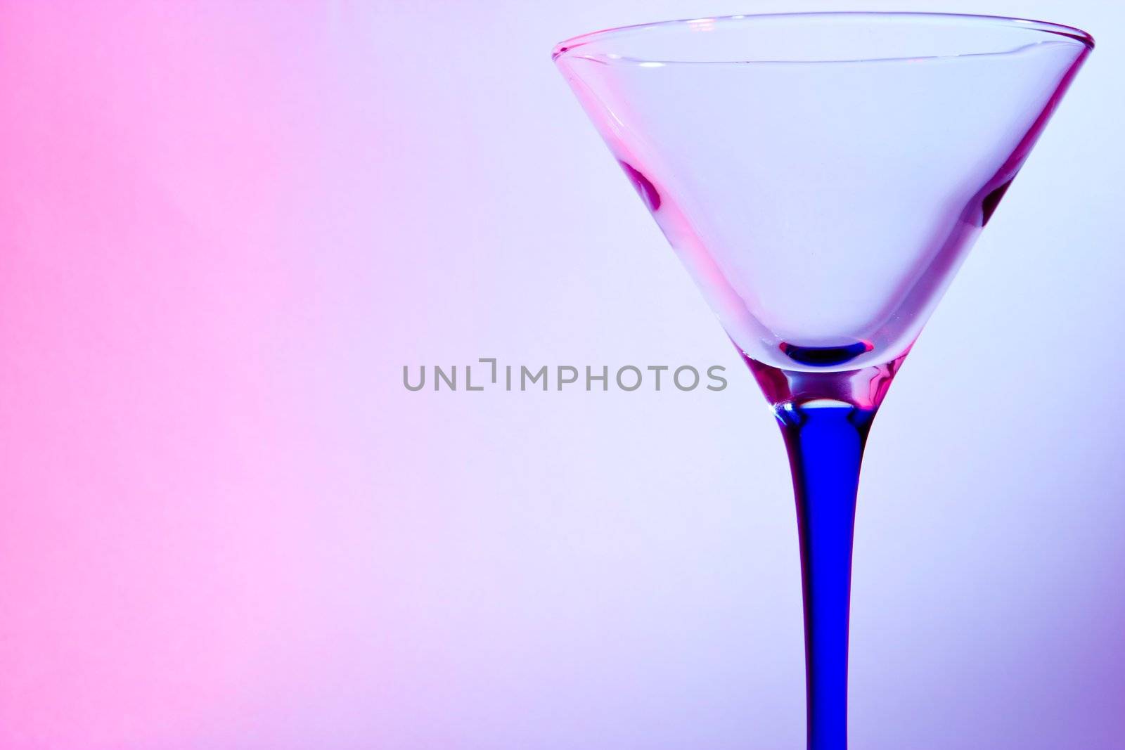 glass for martini  on blue and red background
