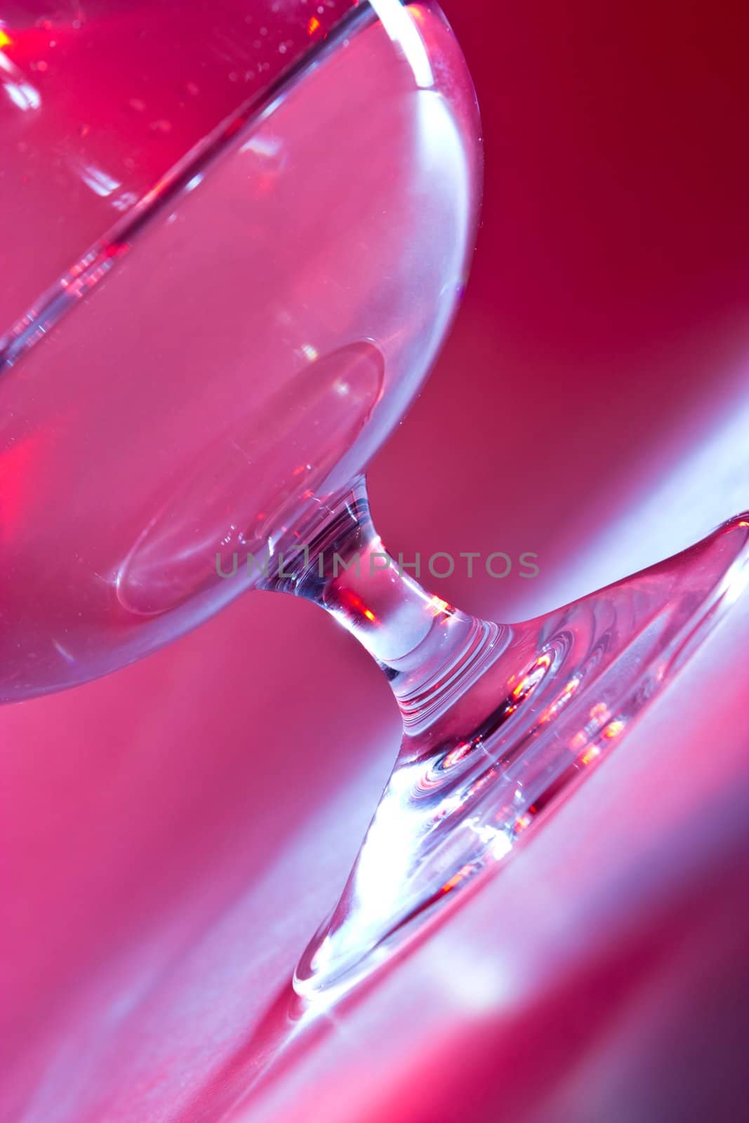 glass for brandy  on blue and red background