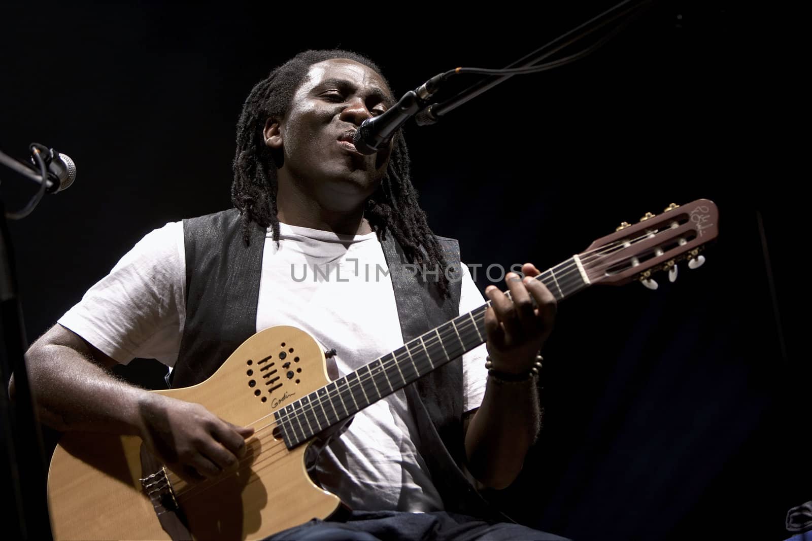 Richard Bona (born October 28, 1967 in Minta, Cameroon) is a jazz bassist and musician. His real African name, as he said live in Montreal in a show with Bobby McFerrin, is Bona Pinder Yayumayalolo.
Photo taken in CEA Philharmonic Gorzow Wielkopolski, Poland.