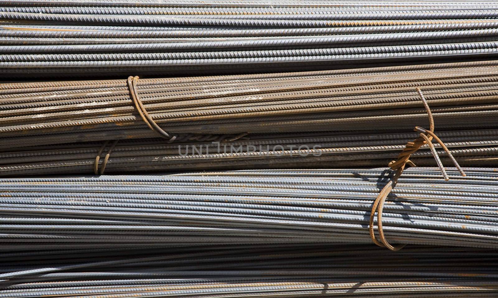 Steel rods or bars used to reinforce concrete.