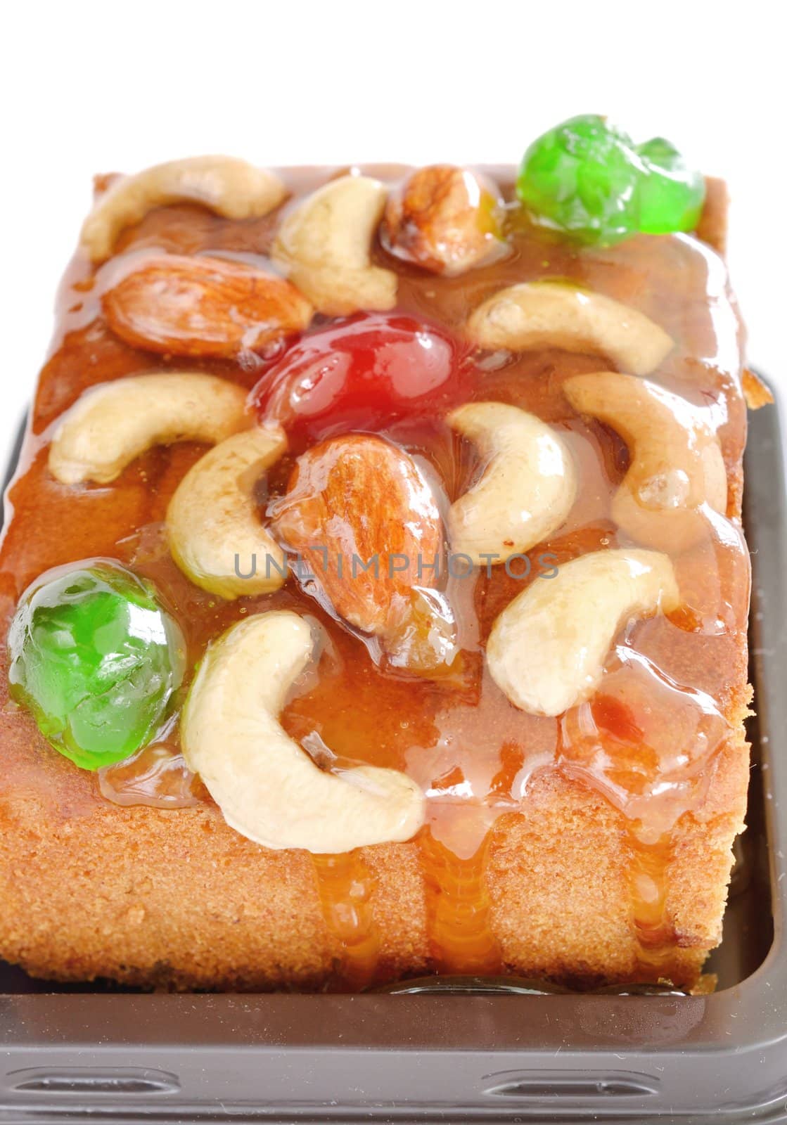 fruits cake with mix nut and dried fruit on white background