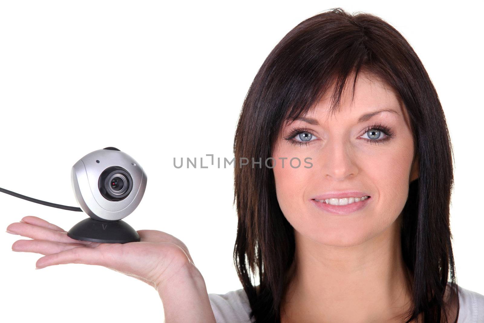 Woman holding web cam by phovoir