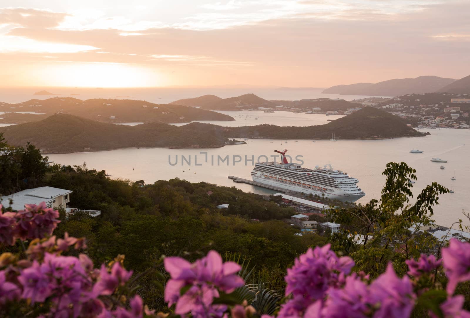 ST THOMAS, USVI- FEBRUARY 19: Sunset over Carnival Liberty cruise ship in Charlotte Amalie on February 19, 2013. The 952ft. ship was built in 2005