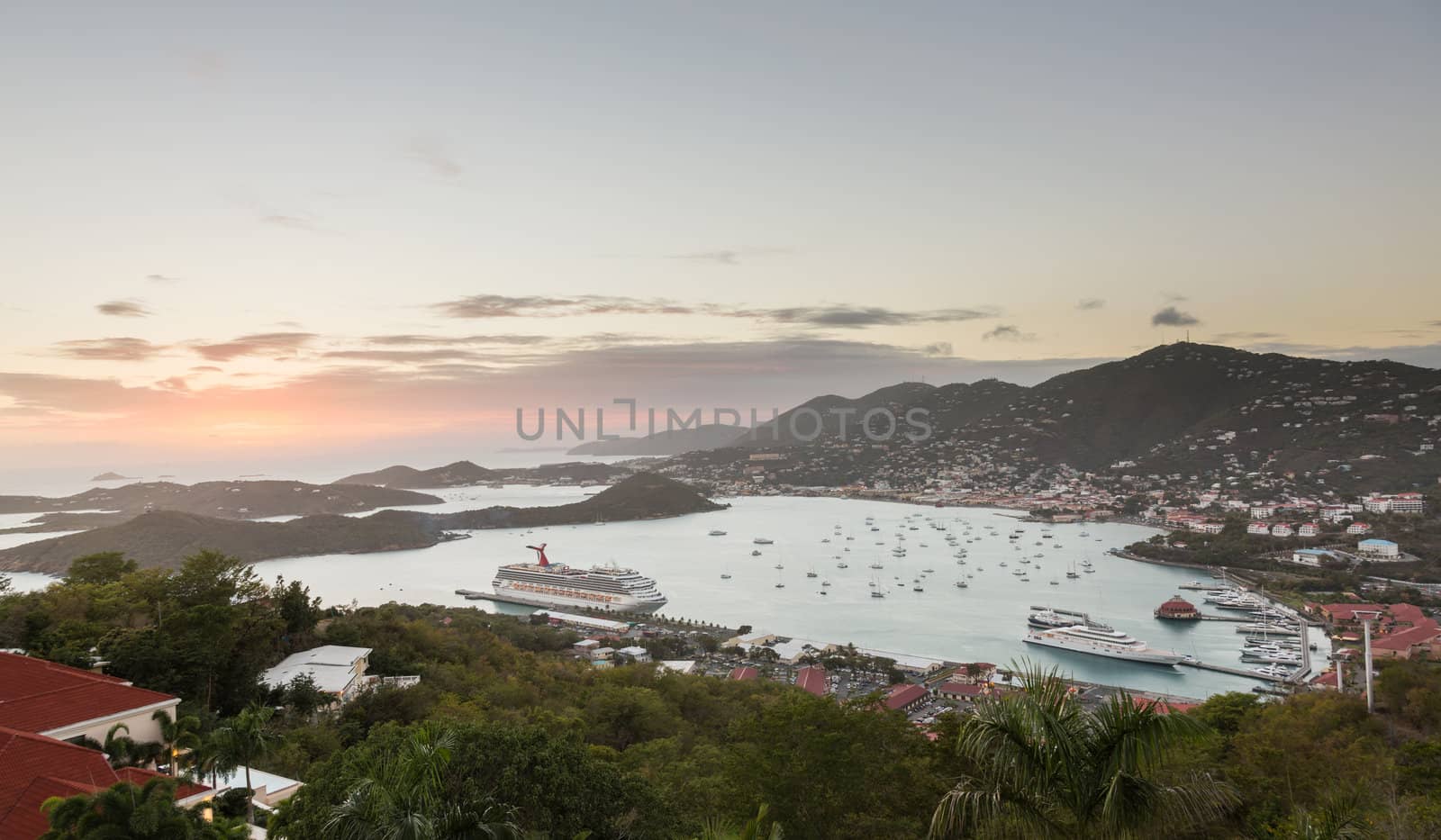 ST THOMAS, USVI- FEBRUARY 19: Sunset over Carnival Liberty cruise ship in Charlotte Amalie on February 19, 2013. The 952ft. ship was built in 2005