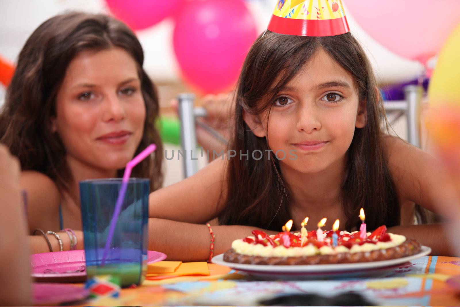 Girl celebrating her fifth birthday by phovoir