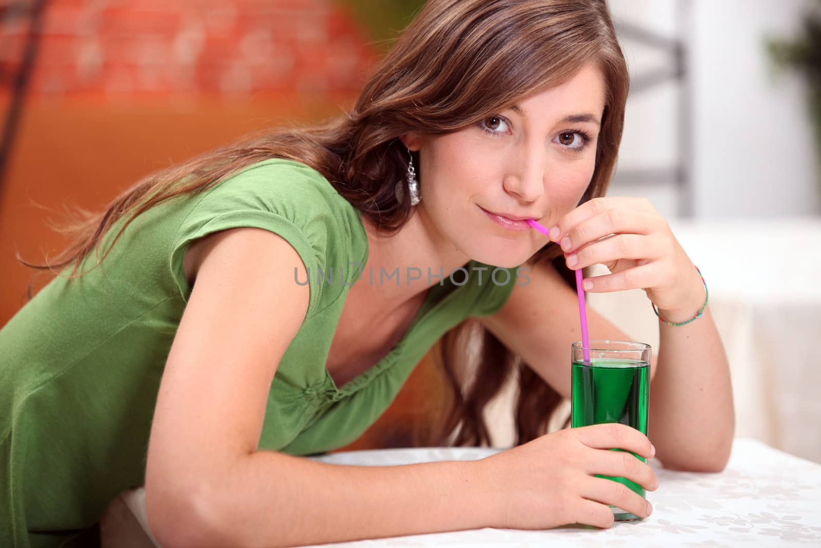 Woman drinking mint flavored water by phovoir