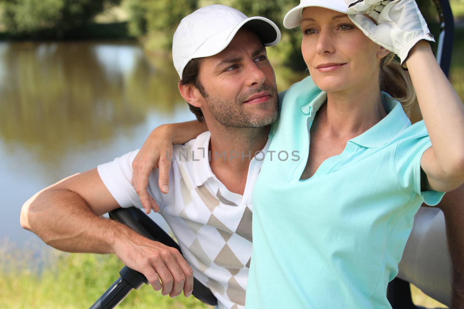 Golfer couple by phovoir