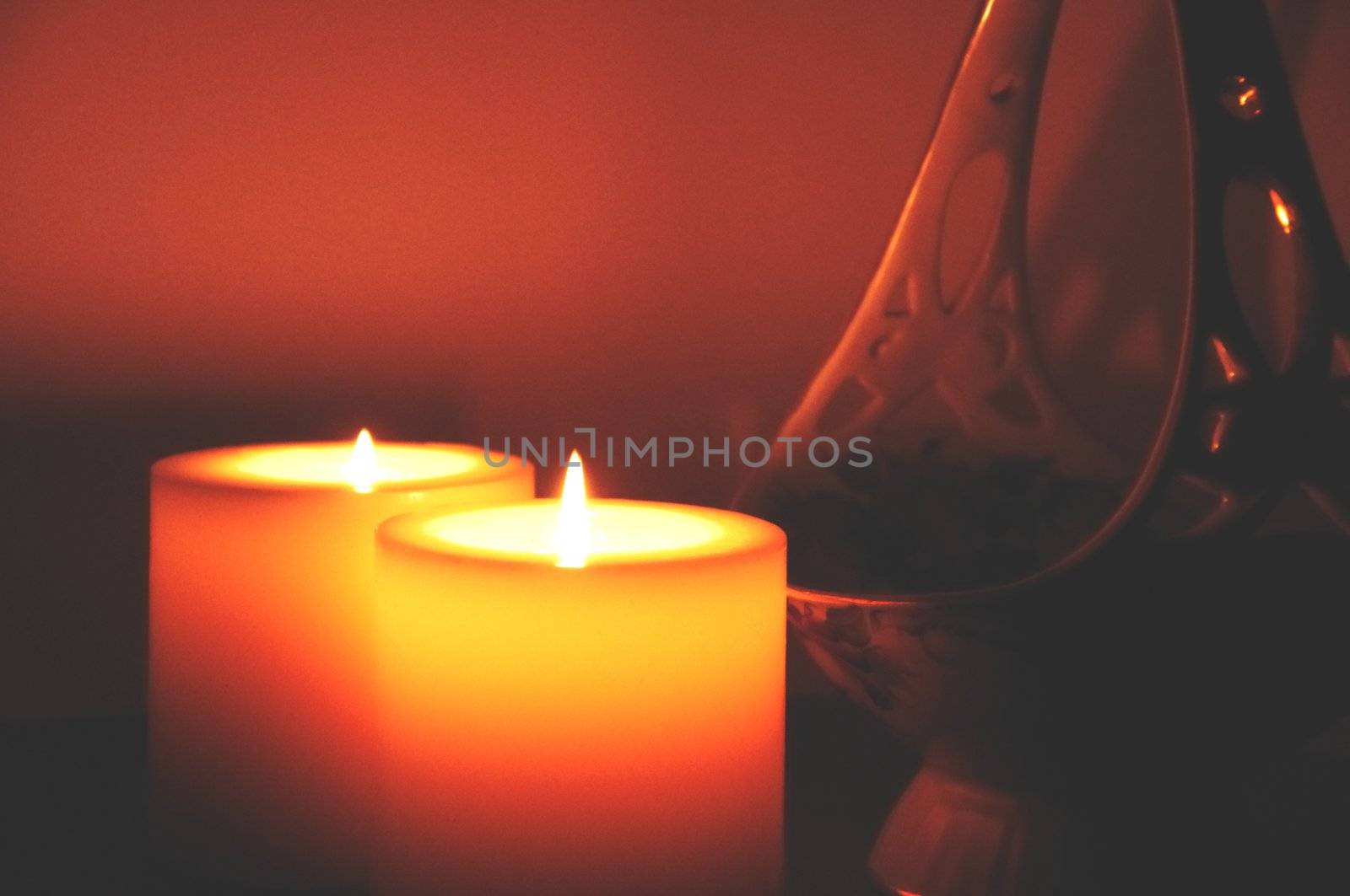 lighted candles on a celebratory dinner in a soft focus close-up