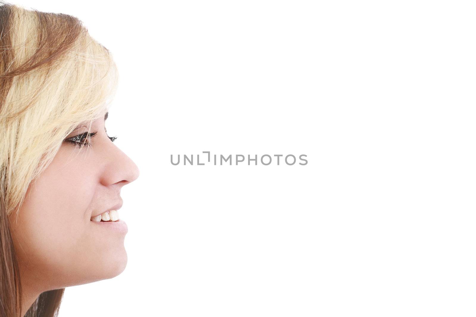 Portrait of a beautiful young woman looking away at copyspace against white background