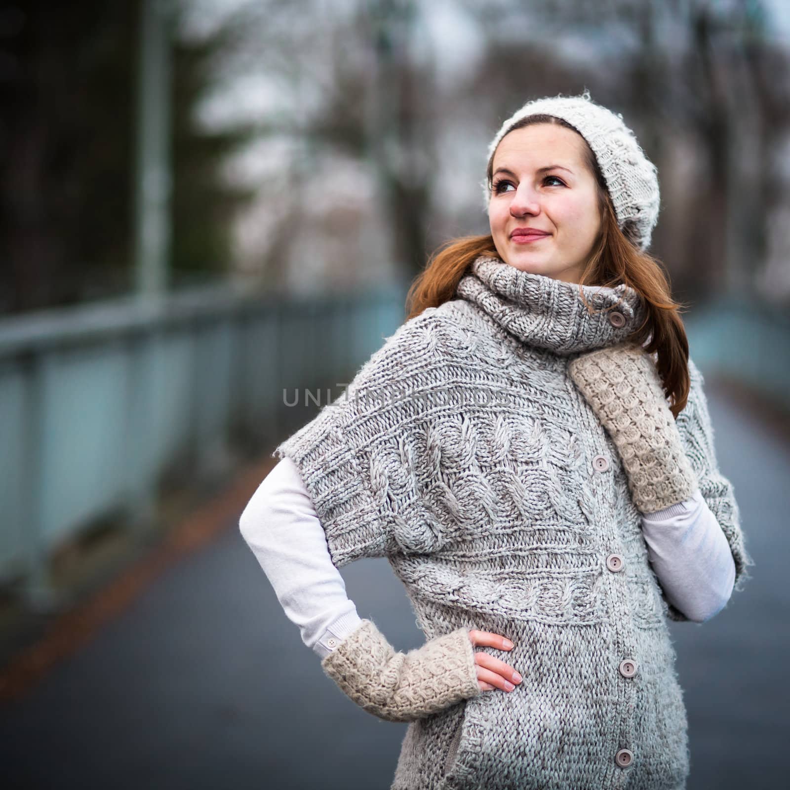 Young woman dressed in a warm woolen cardigan by viktor_cap