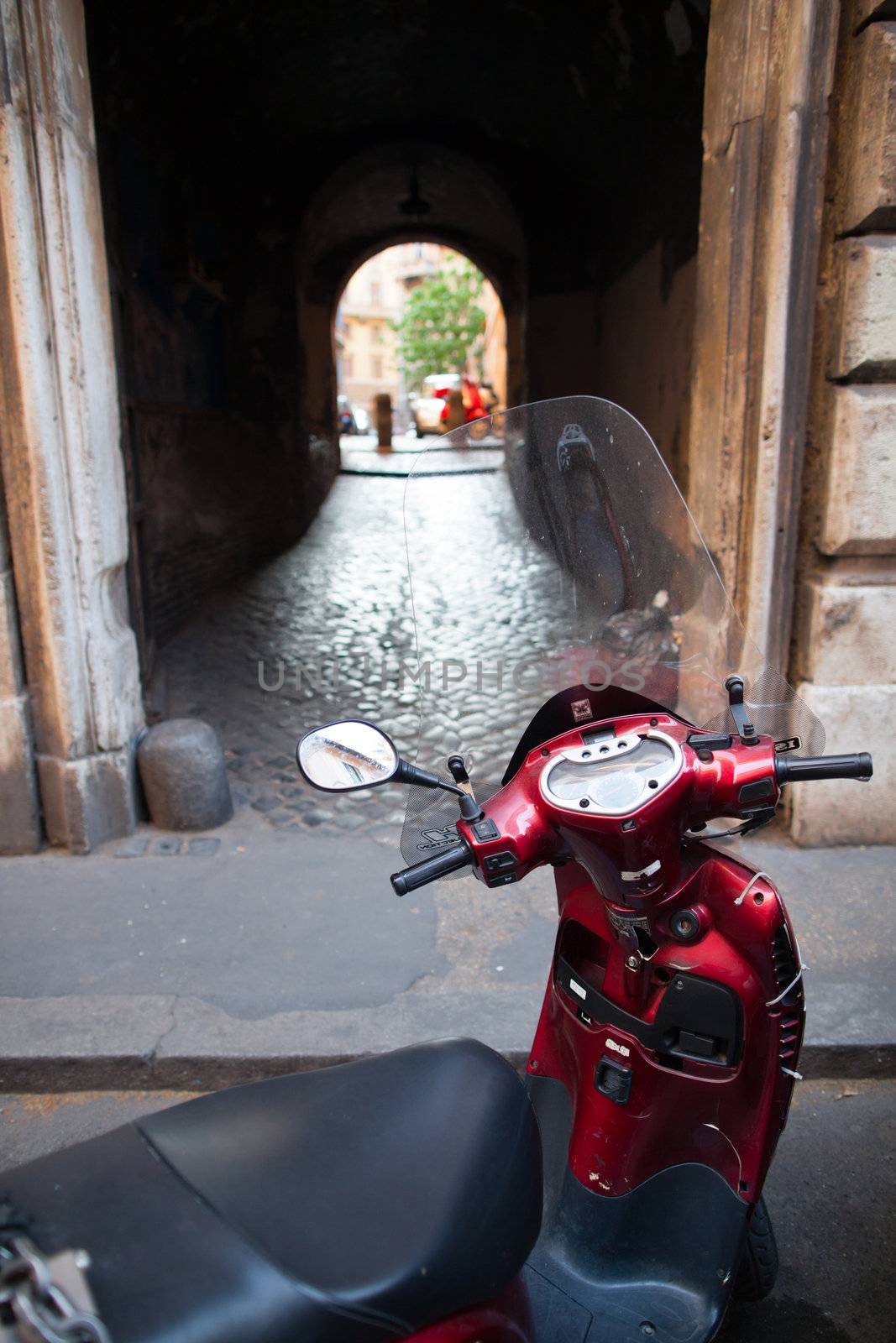 Scooter parked in one of the ancient streets of Rome