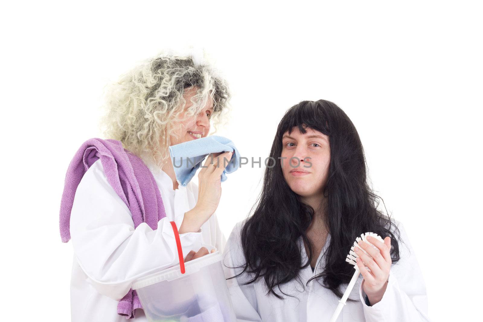 Female cleaners in white work coats