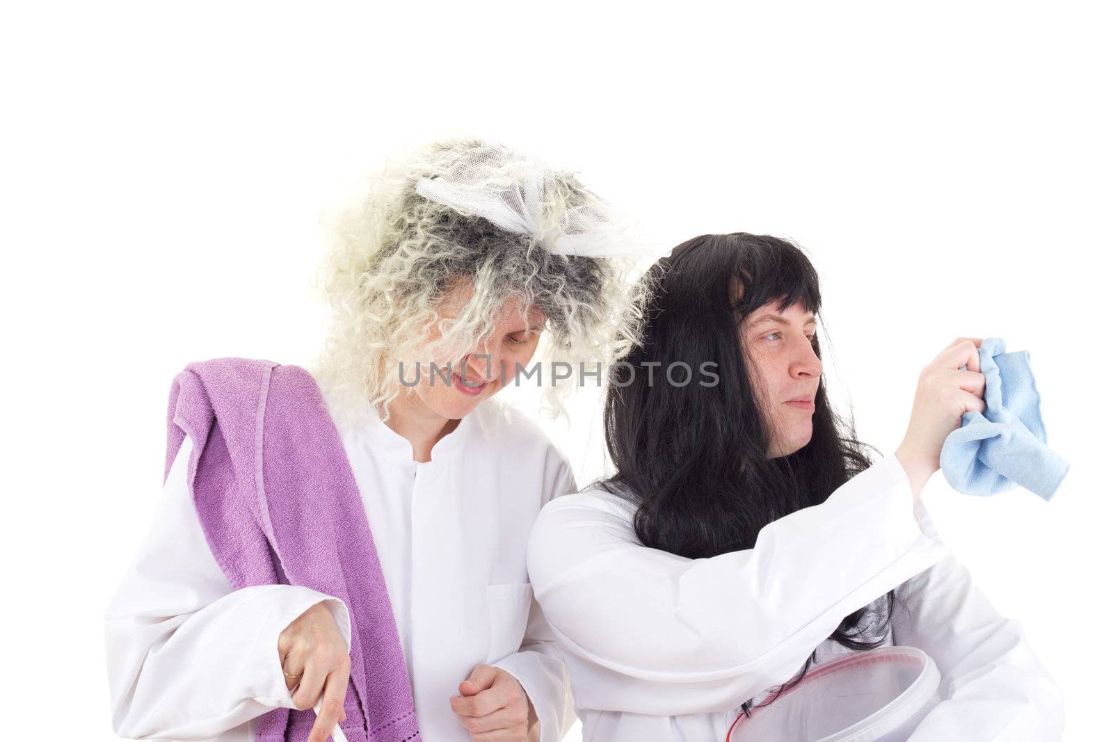 Female cleaners in white work coats