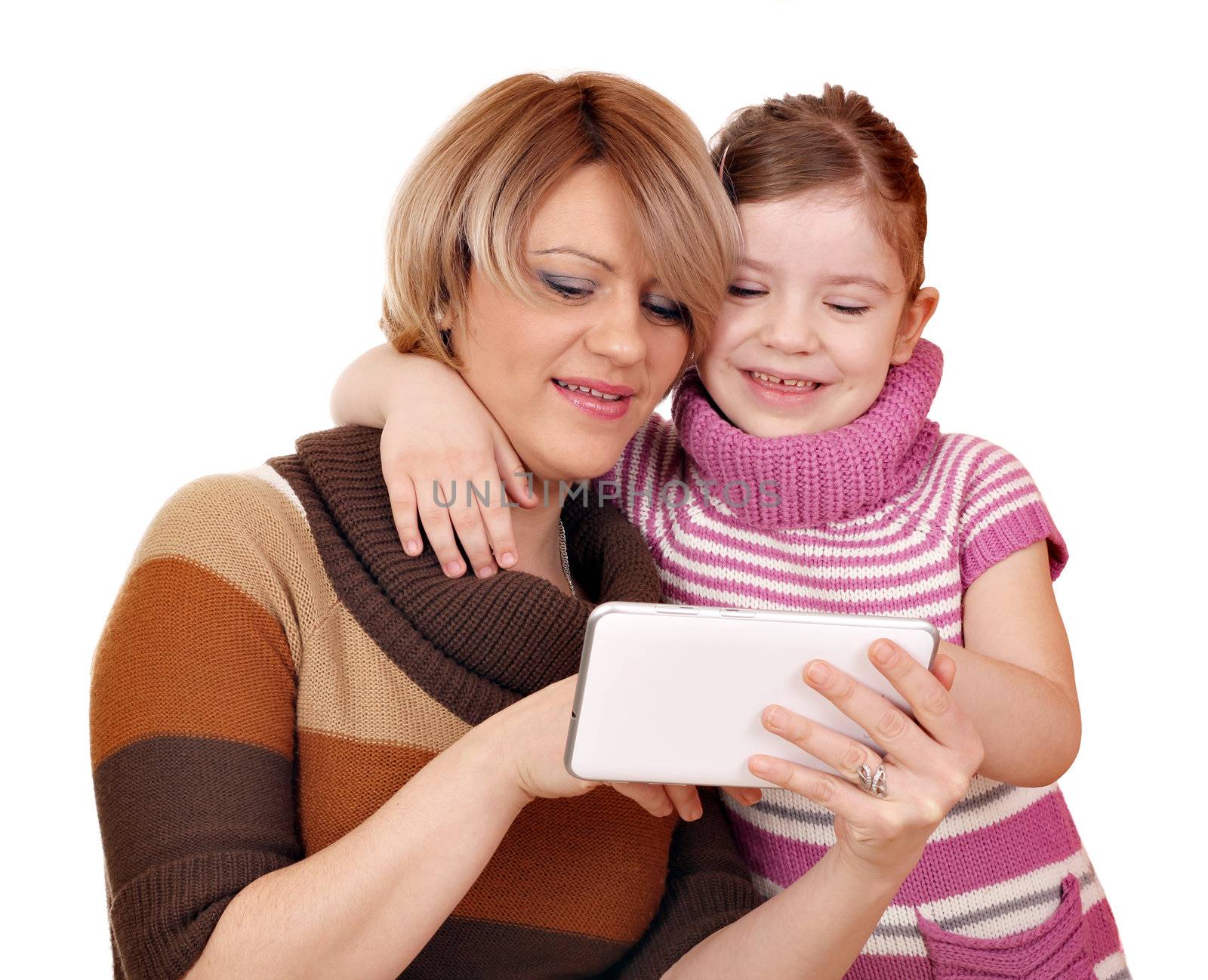 mother and daughter play with tablet pc on white 
