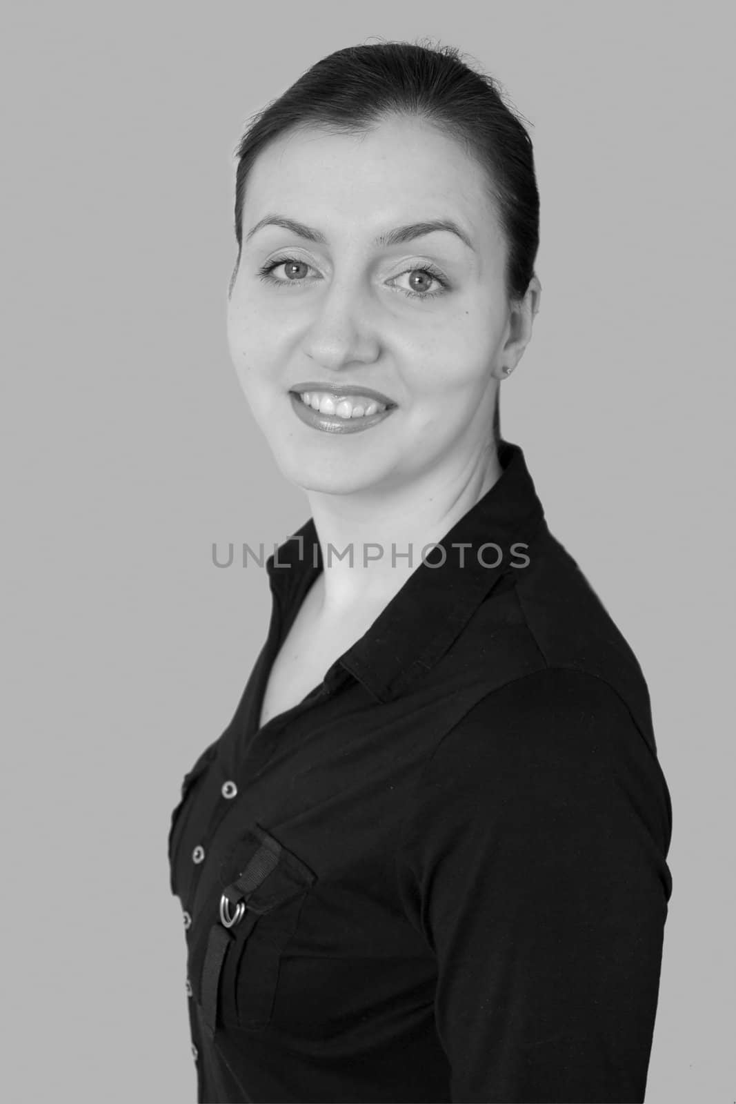Smiling woman on a grey background