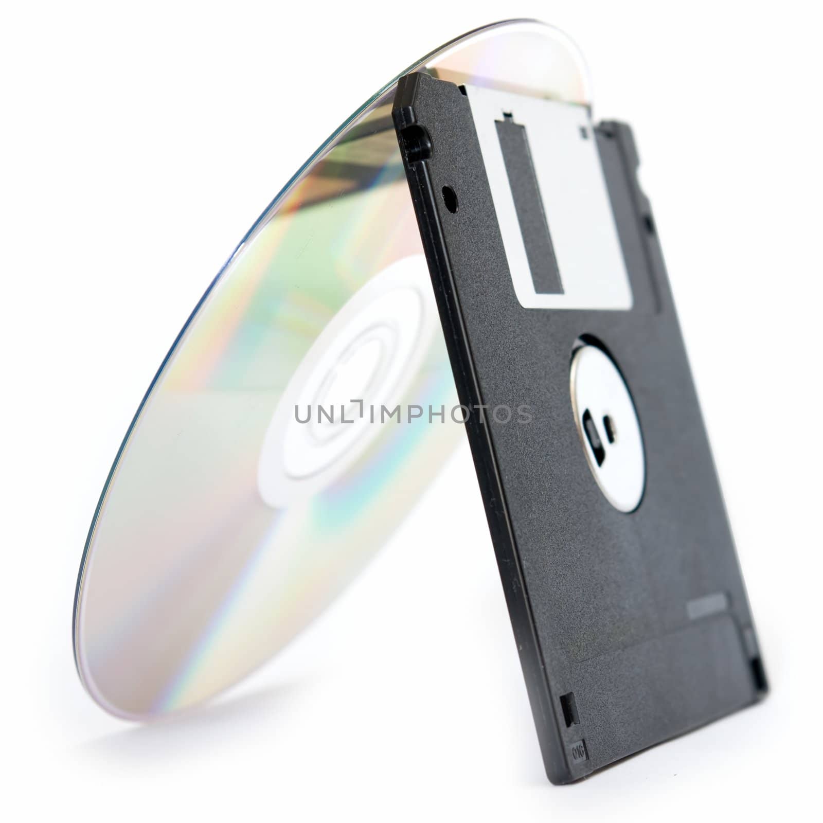 CD and floppy disk isolated on white