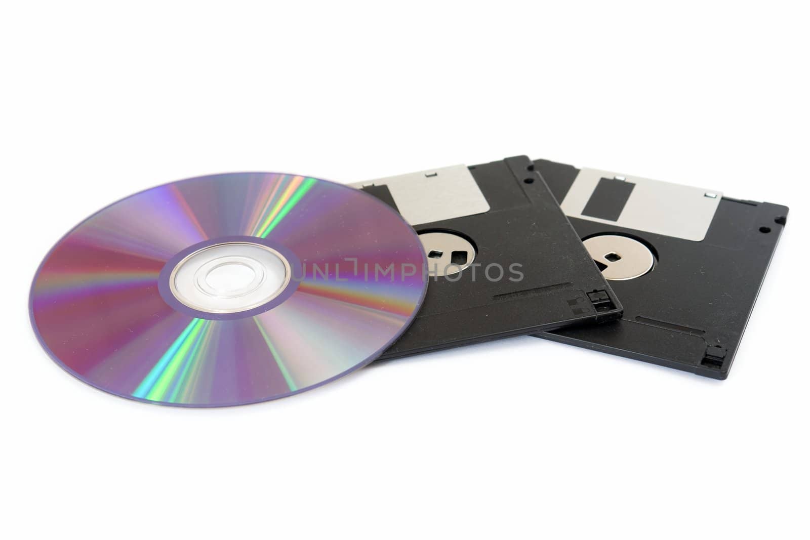 CD and floppy disk isolated on white