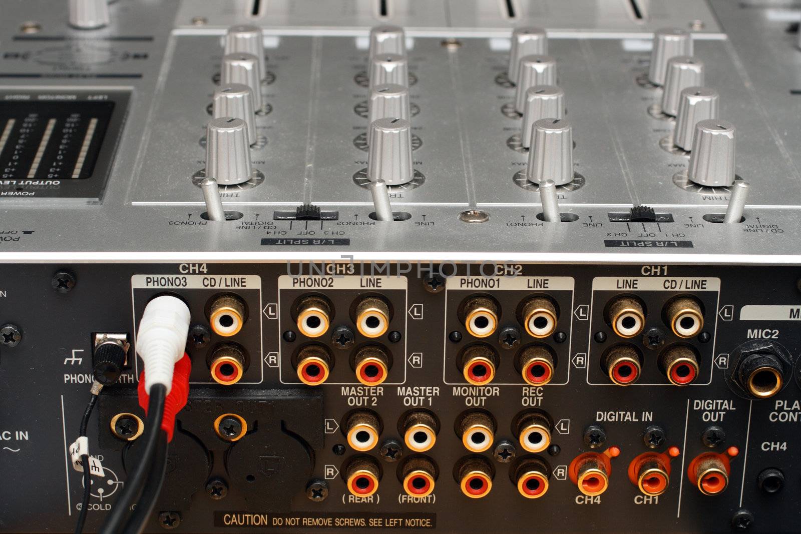 back panel with sockets of dj music mixer close-up