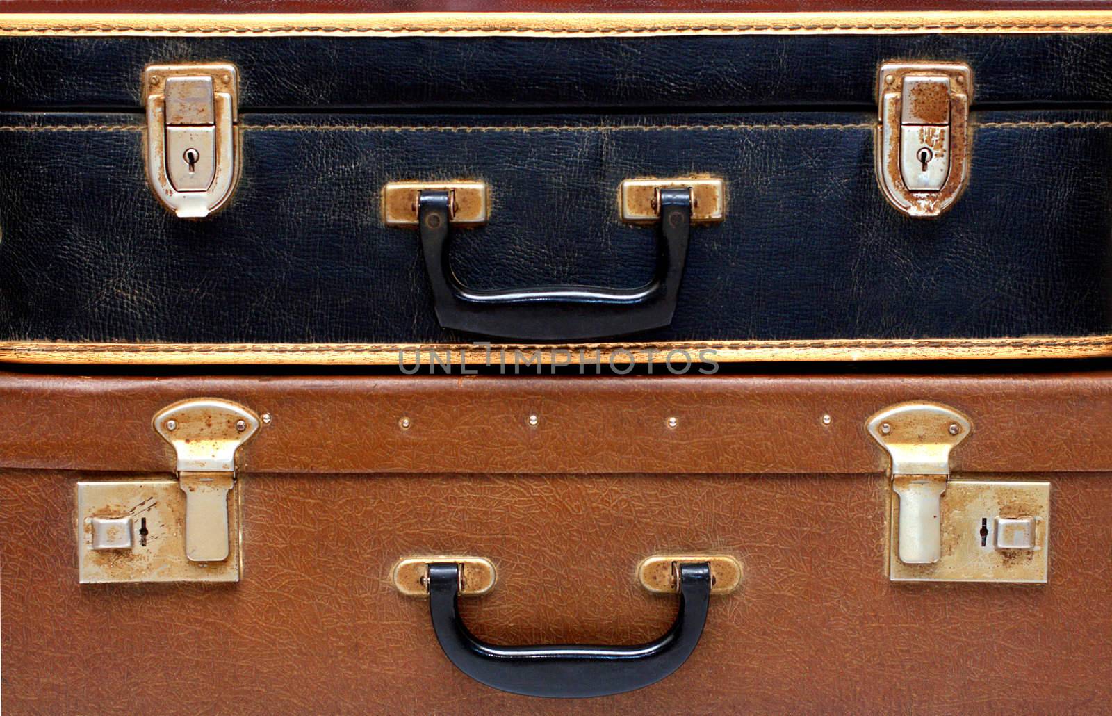 black and brown old battered cases close-up