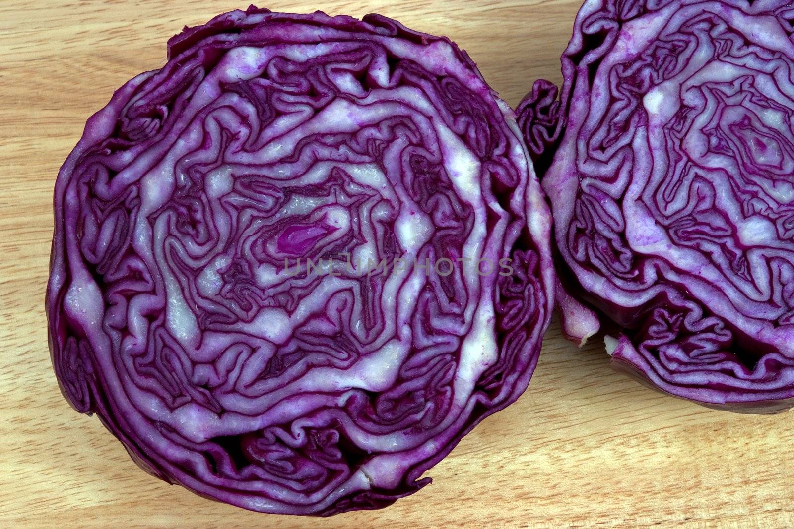 Red cabbage cut in half showing the growth pattern