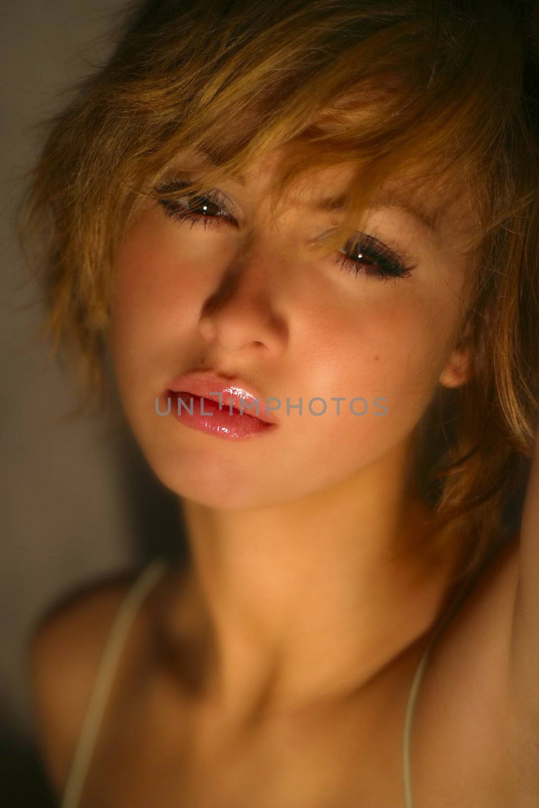 Portrait of the beautiful young girl with sad mood