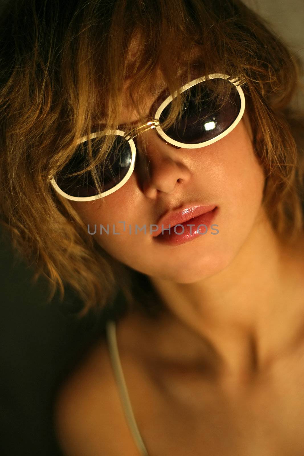 The attractive girl in solar glasses