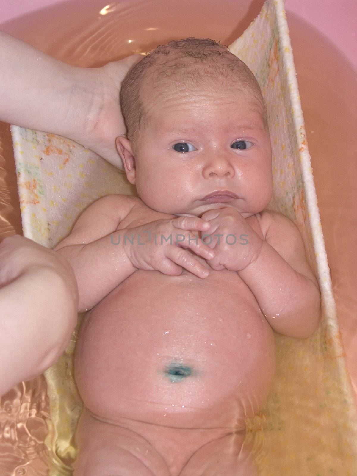 The image of the kid taking a bath