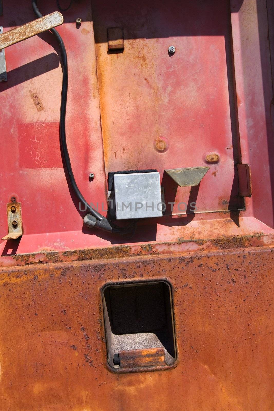 Side of old rusty machinery.