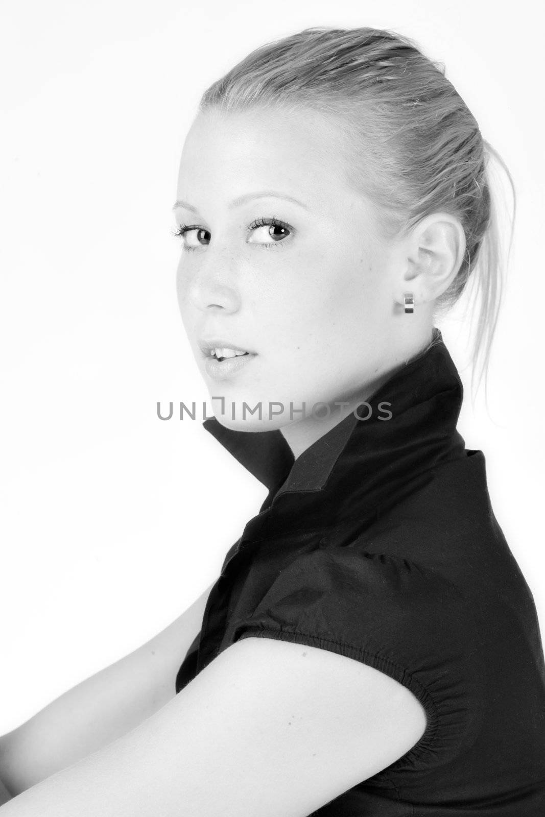 Studio portrait of a young blond girl paying attention