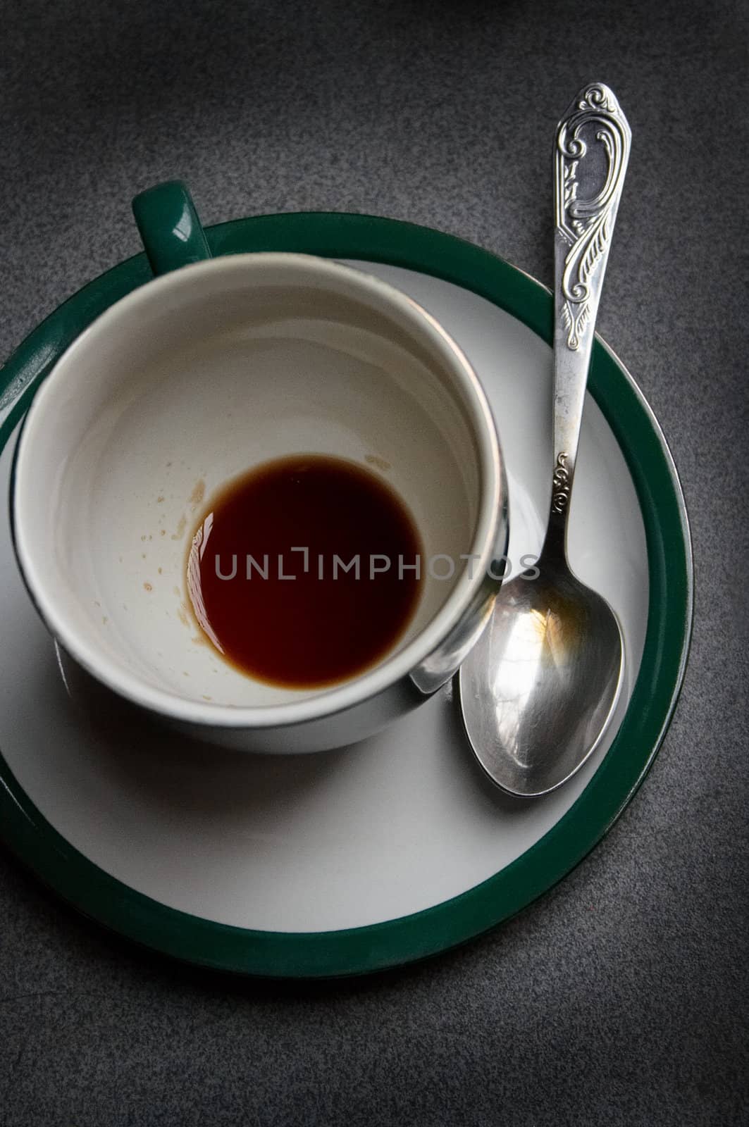 Cup with the drunk coffee and the spoon