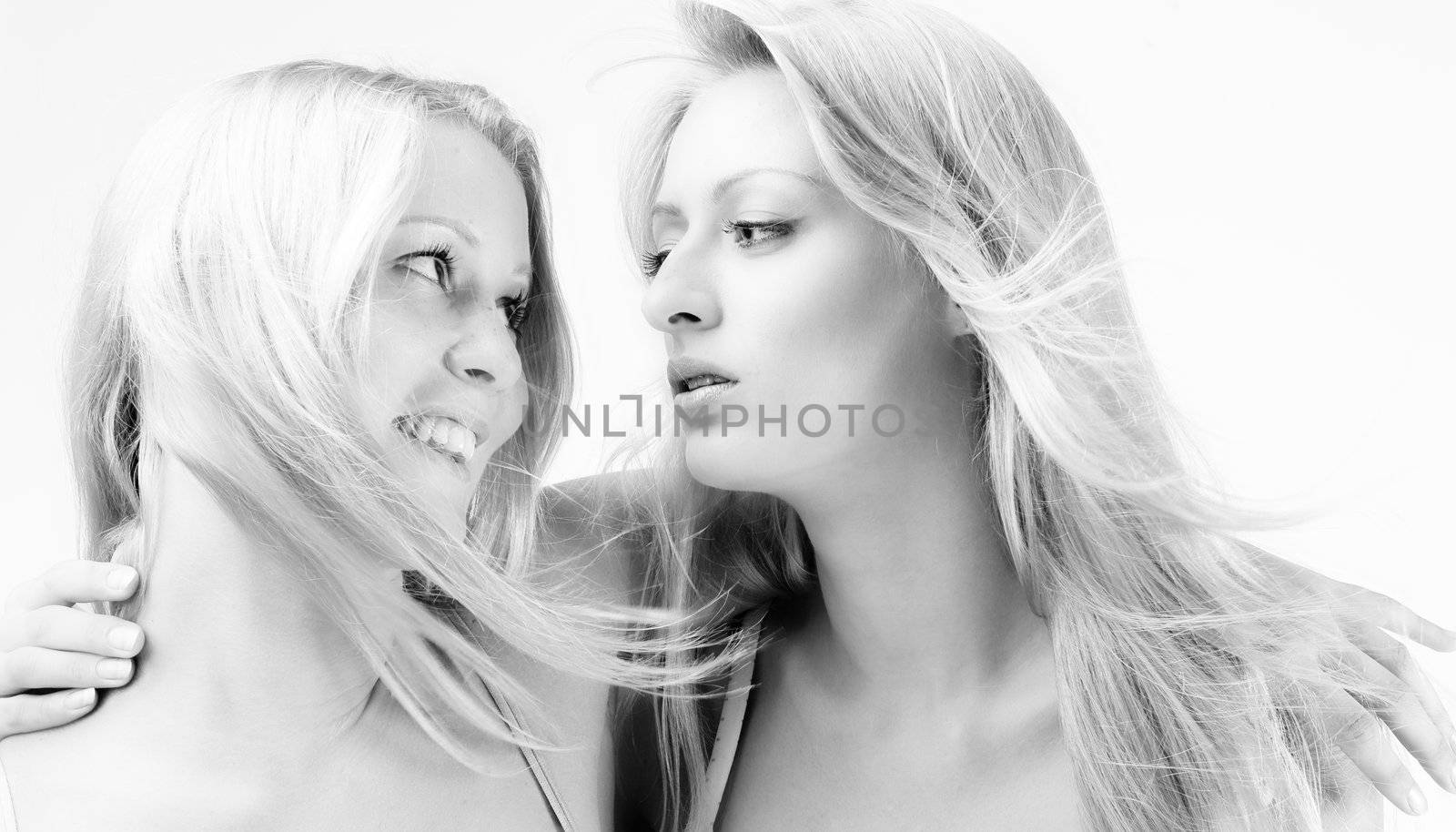 Two sisters looking at eachother passionate