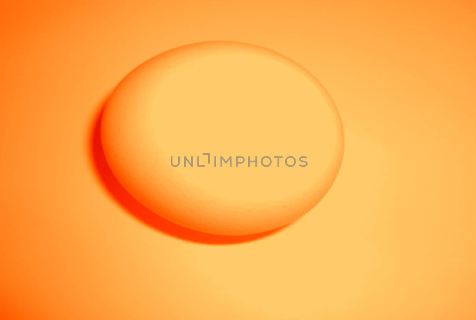 an orange egg on an orange background