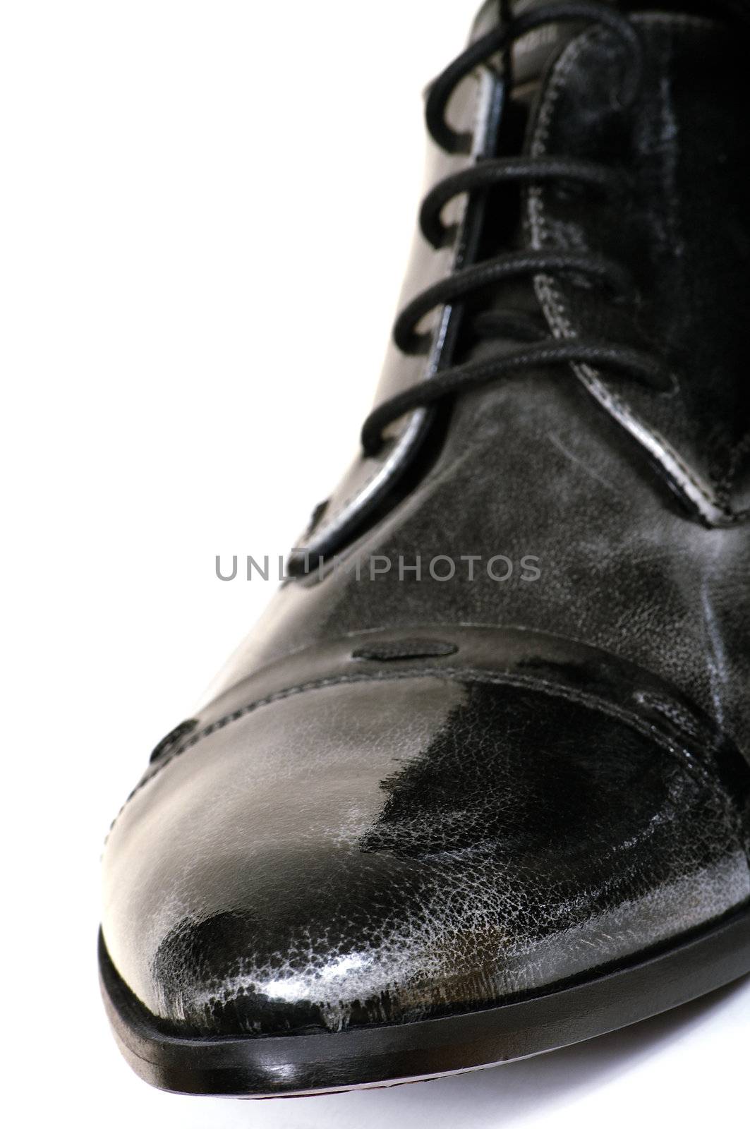 Black man's boot on a white background