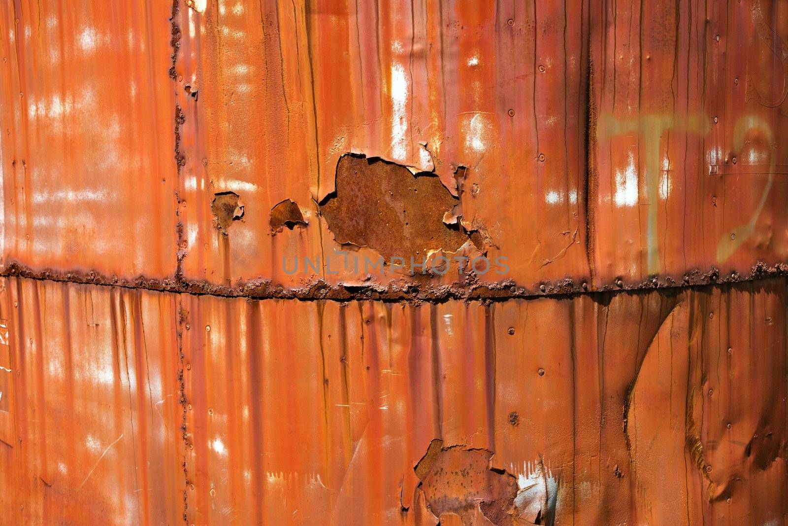 Closeup of metal orange container.