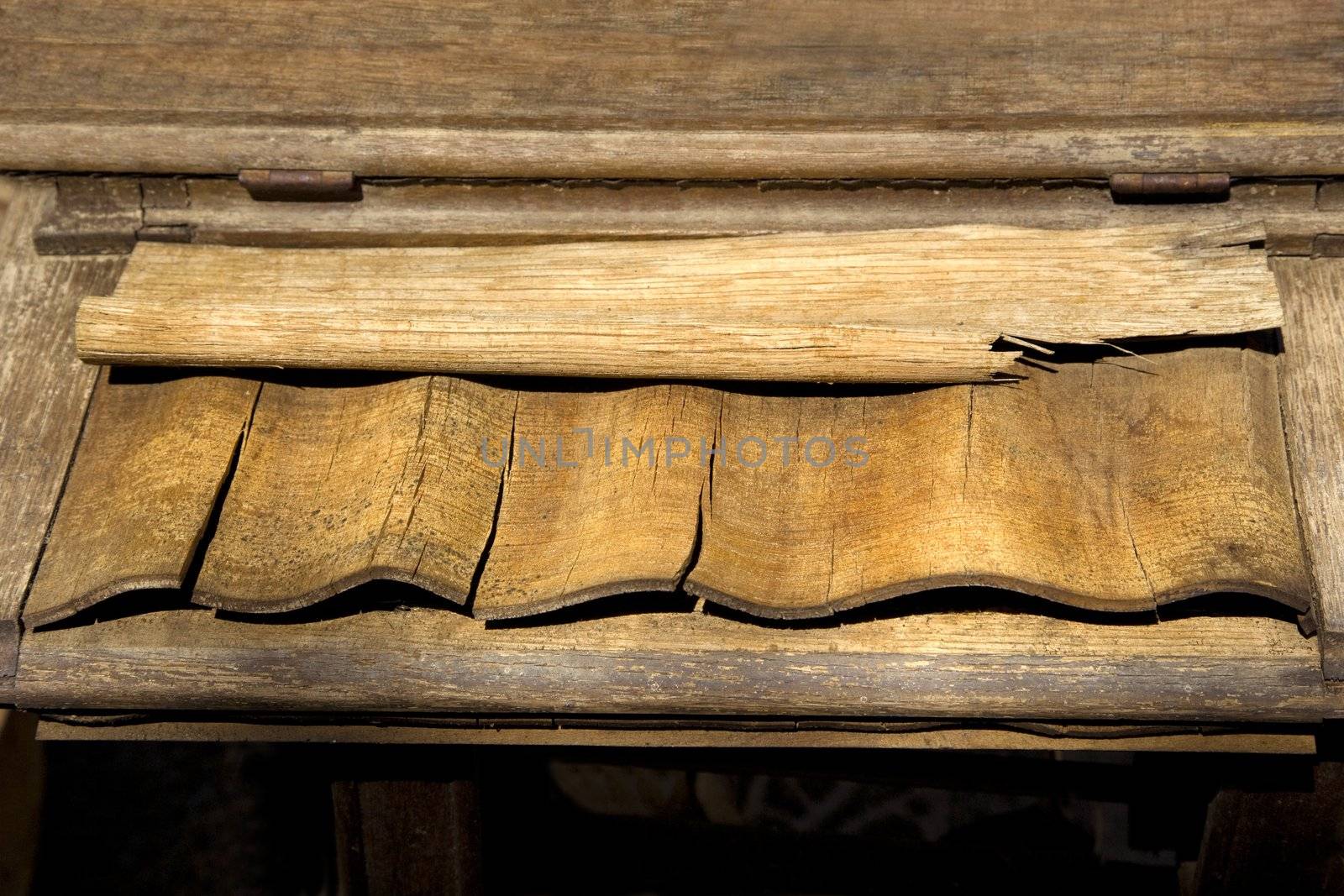 Pieces of weathered wood on shelf.