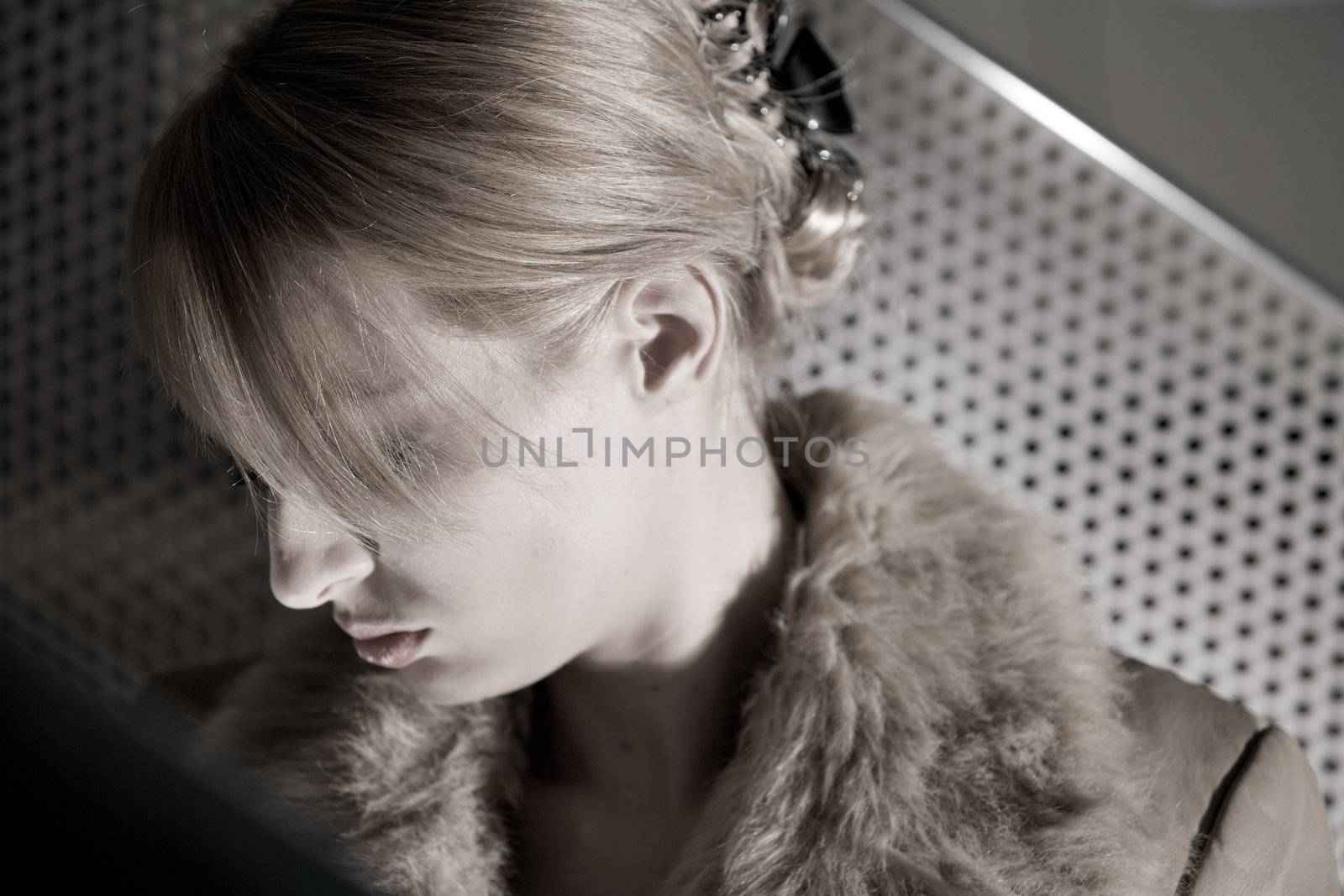 Portrait of a beautiful blond girl looking sad