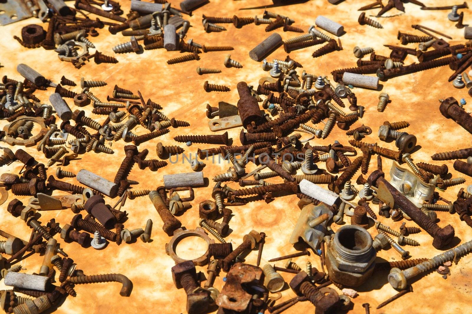 Old rusty screws and parts. by iofoto
