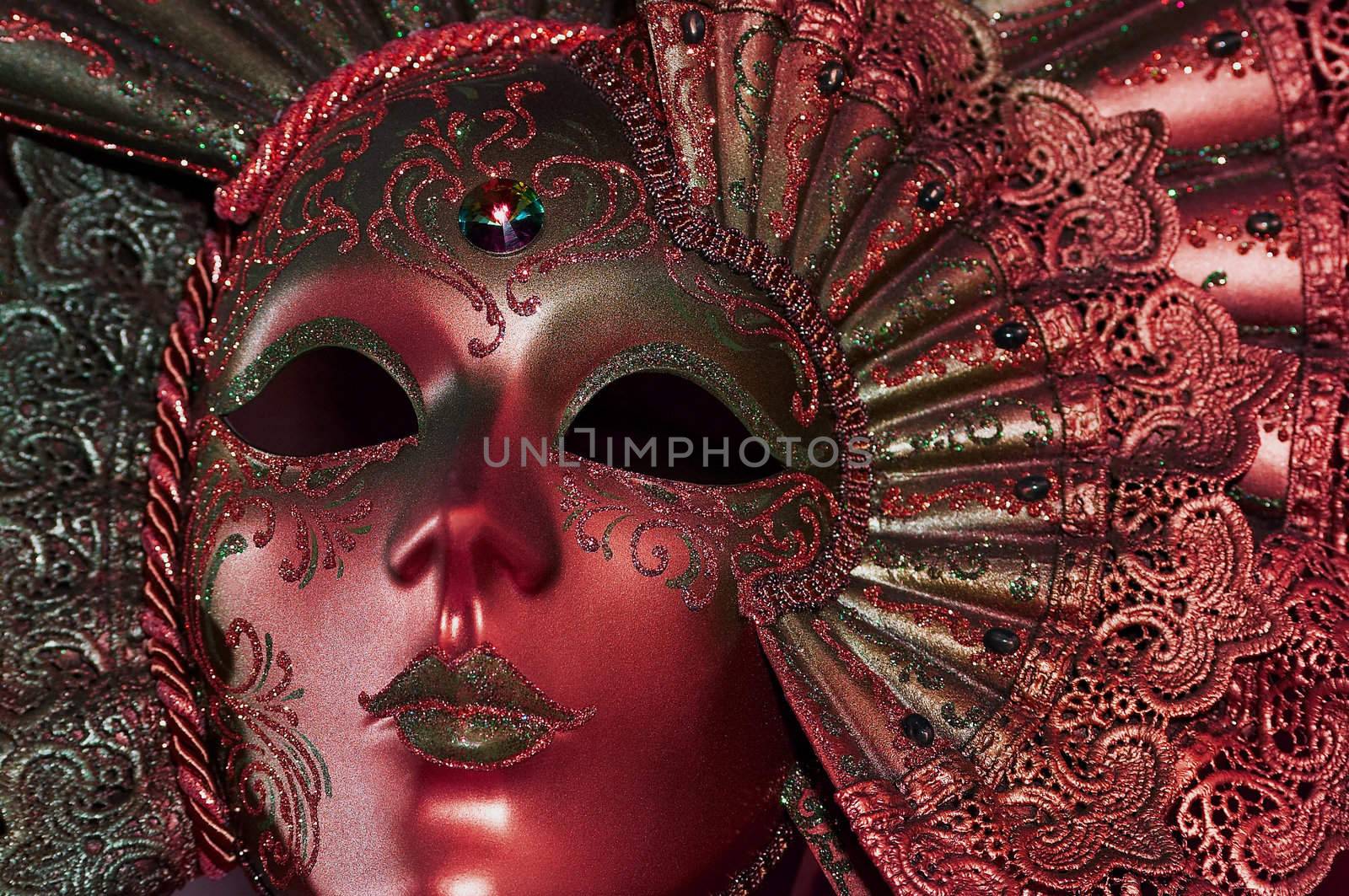 Celebratory dark red mask with a jewel