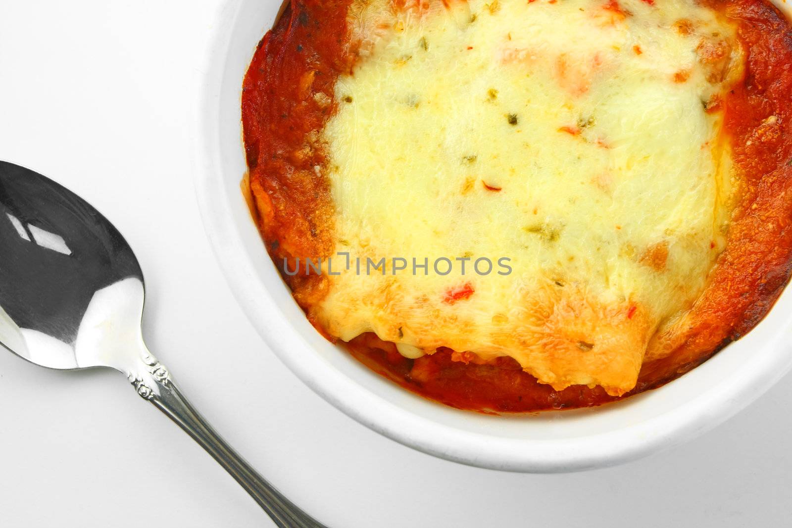 Baked Lasagna with Spoon, overhead view.