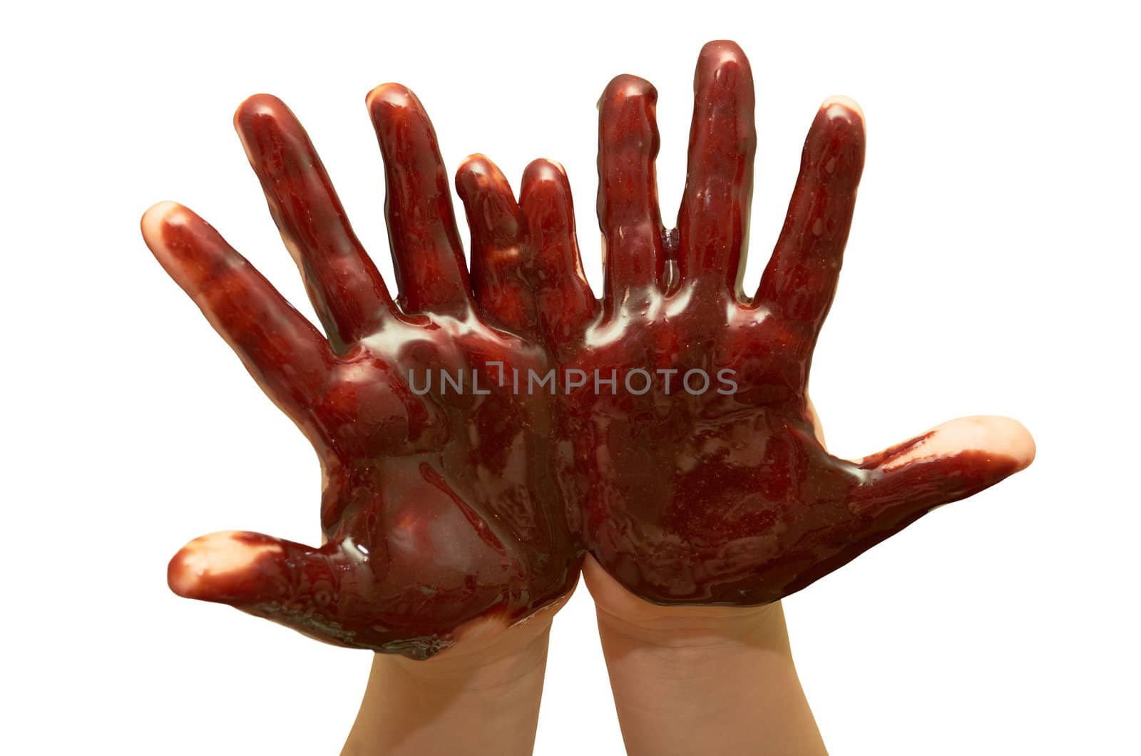 Small children's hands soiled with chocolate glaze