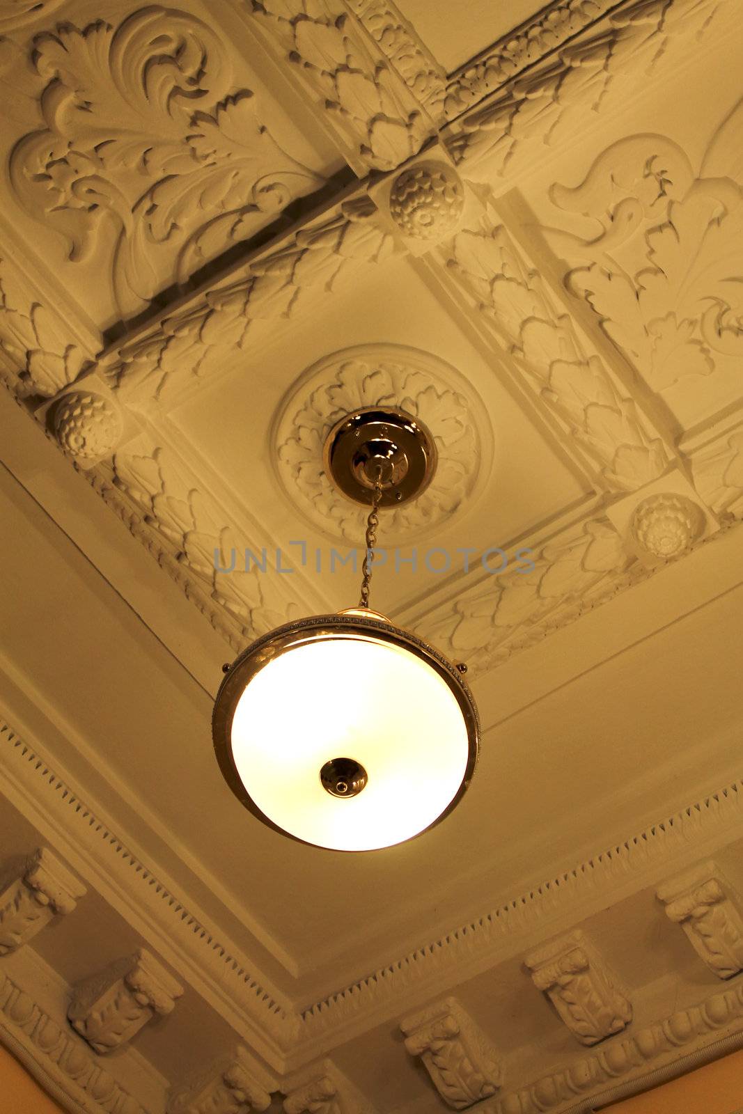 Bronze chandelier with moldings (view from below)