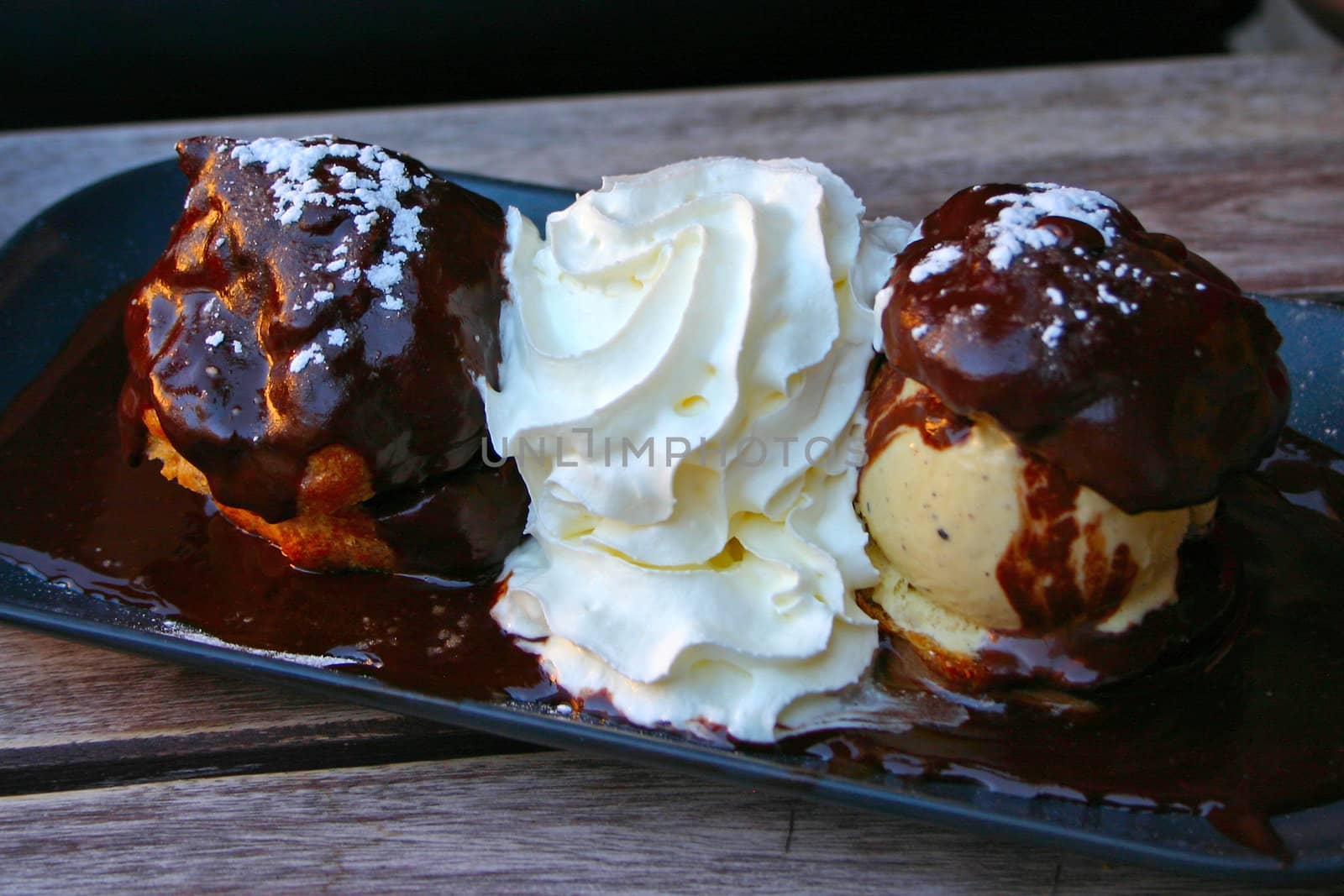 Profiterole with ice covered with chocolate