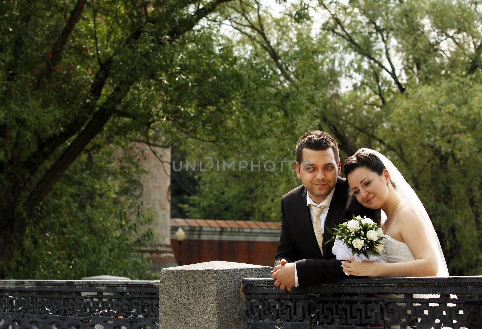 Newly-married couple in park