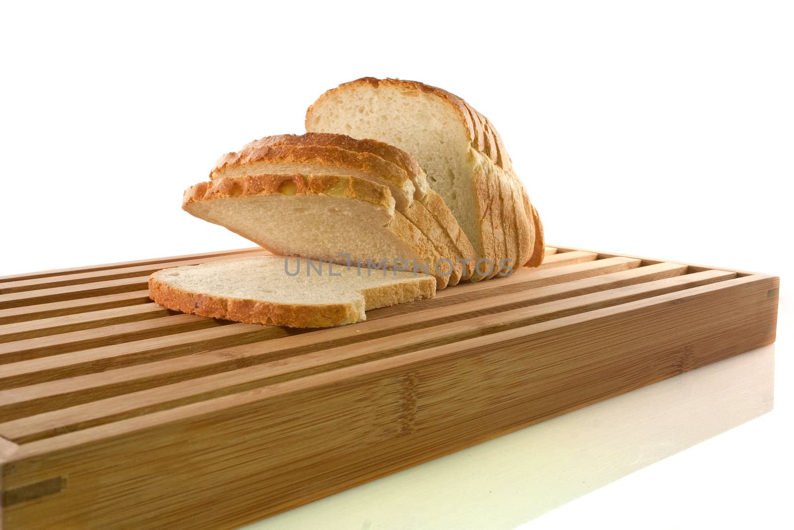 Bread chopping board with slices of white bread