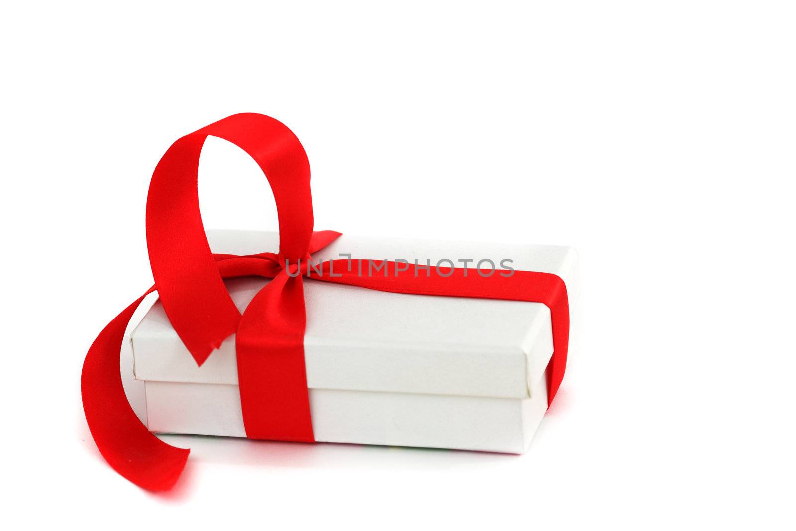 white christmas gift with red ribbon