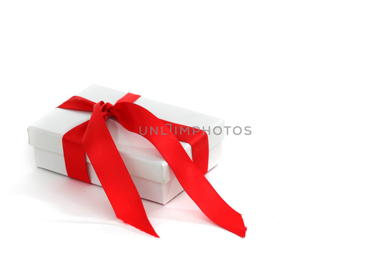 white christmas gift with red ribbon