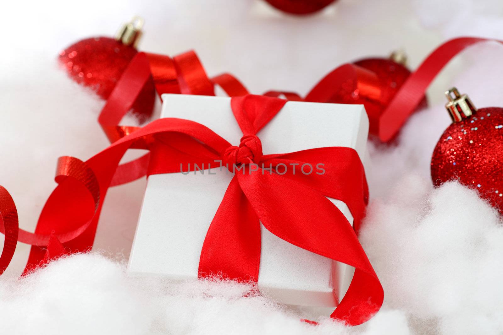 white christmas gift with red heart ribbon
