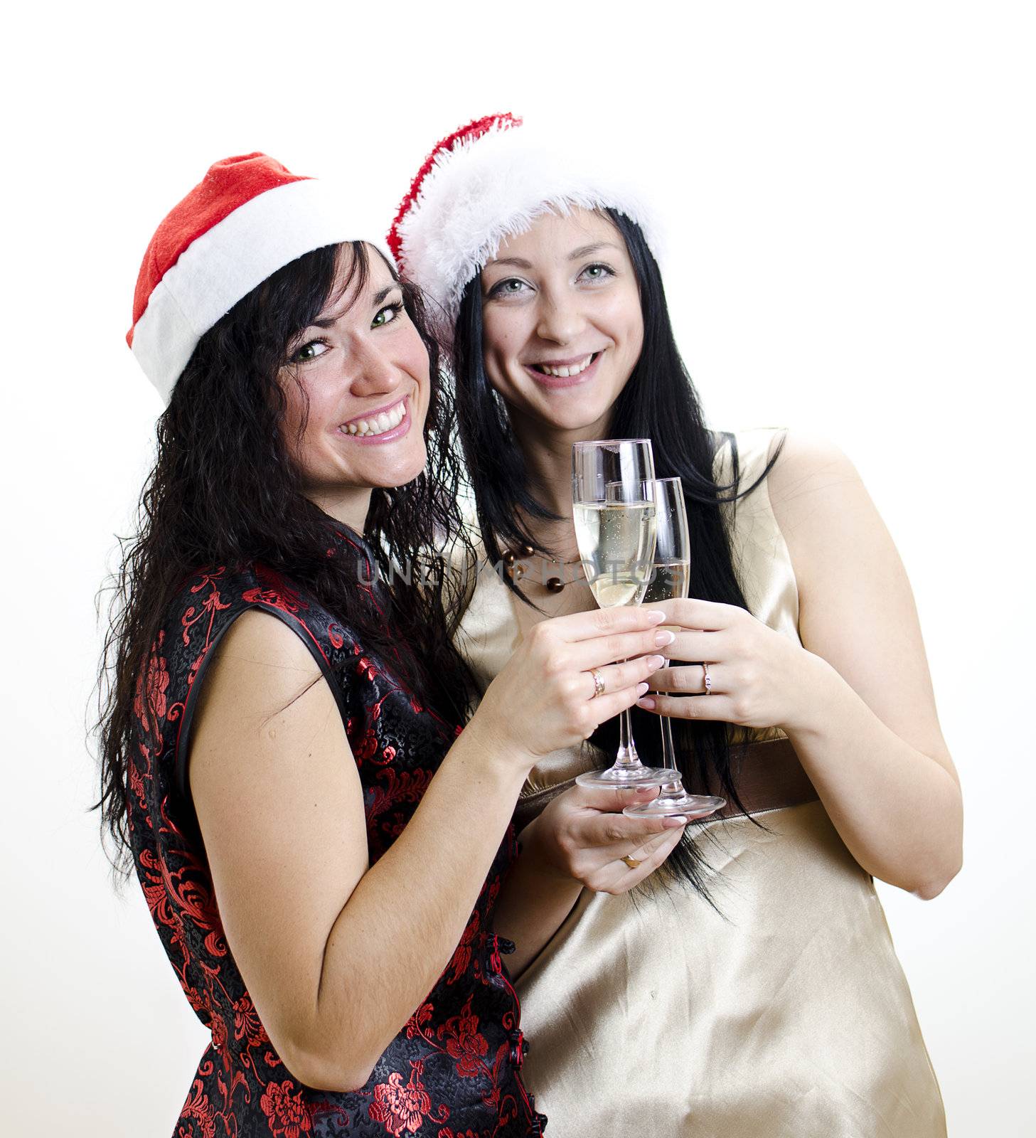 Christmas: two girls in red hat have fun 