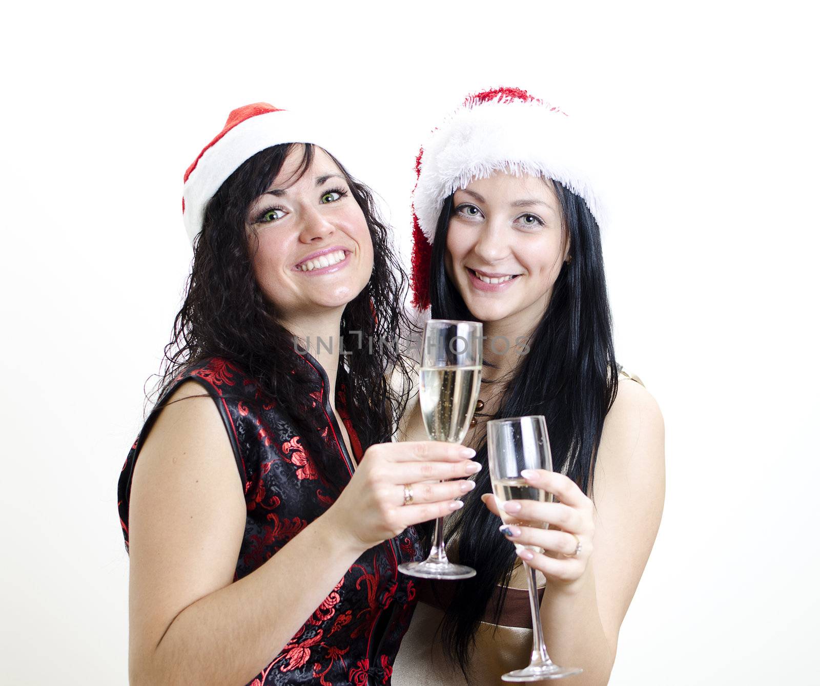 Christmas: two girls in red hat have fun 