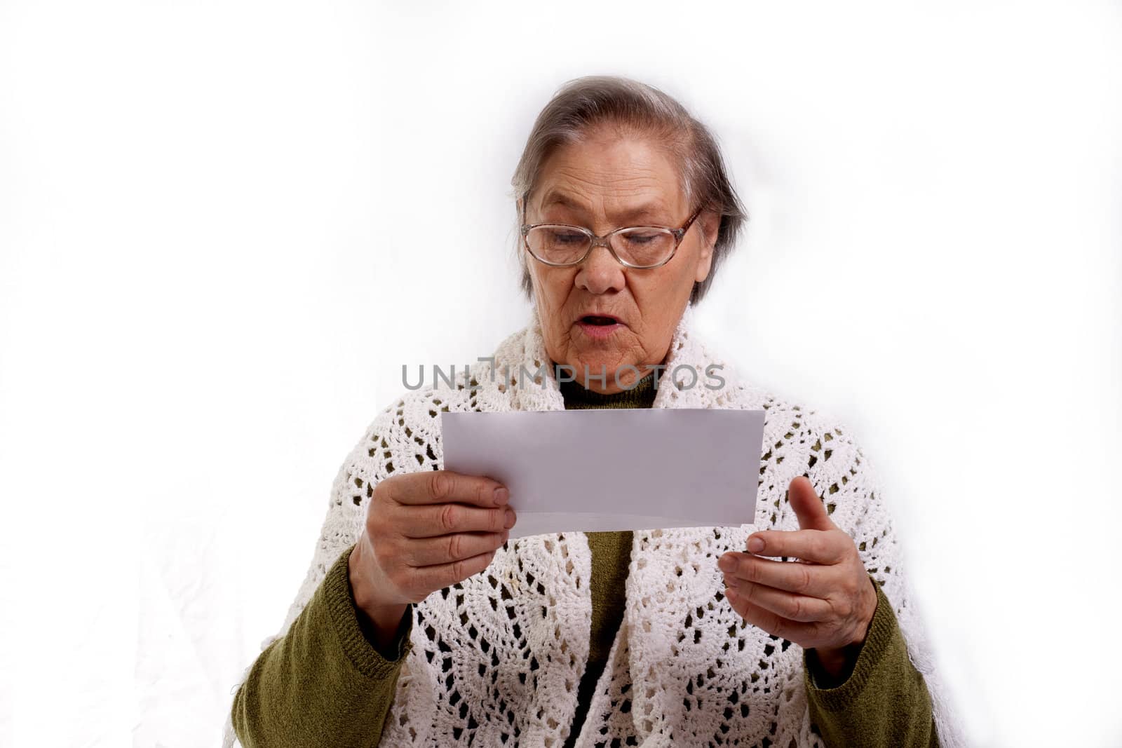 old woman shocked about her bills isolated on white background